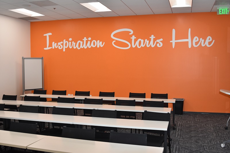 Training room with back wall quote "Inspiration Starts Here"