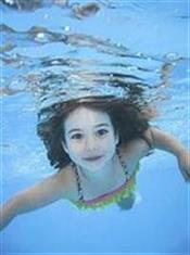  (photo: child swimming in pool)