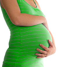 photo: pregnant woman in green shirt