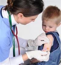 Doctor giving child shot