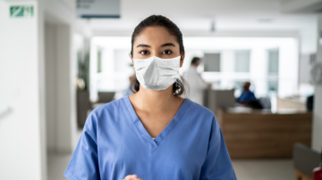 Woman with scrubs and mask