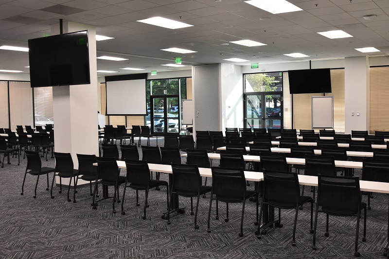 Training room filled with desks and chairs