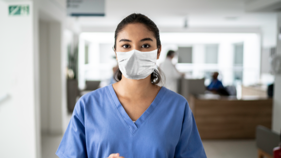 Woman with scrubs and mask