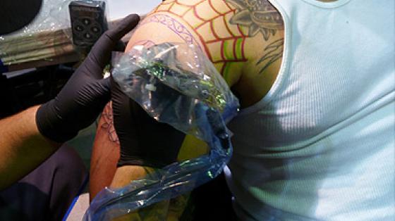 Man getting Bodyart on shoulder