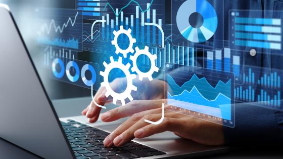 person working on laptop with floating charts and graphs