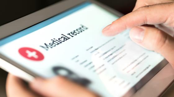 electronic tablet displaying "Medical record"