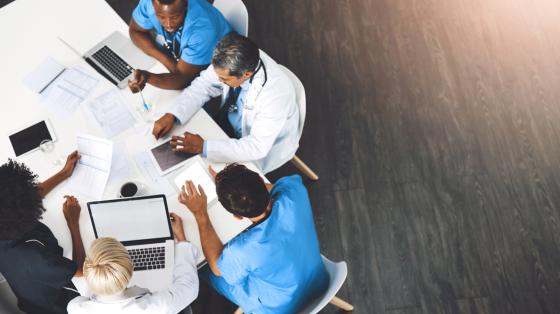 medical professionals collaborating at a table
