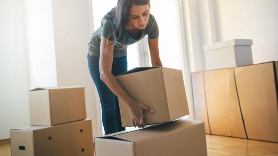 Woman moving boxes