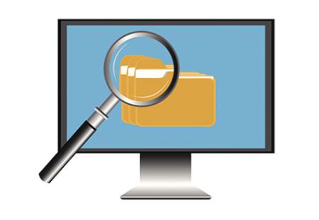 Computer screen with magnifying glass looking at tabs of folders