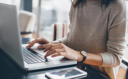 Lady typing on laptop