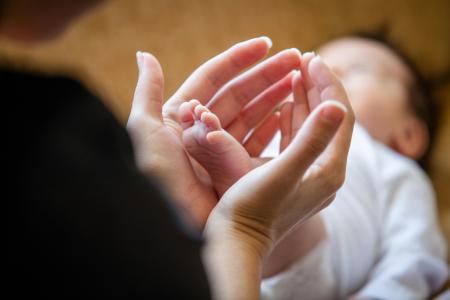 hands and baby feet