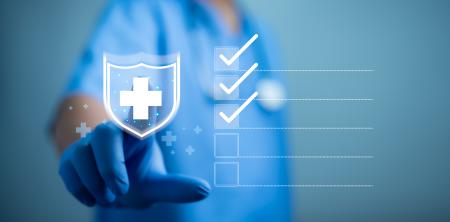 first aid symbol, check marks, and medical professional in the background